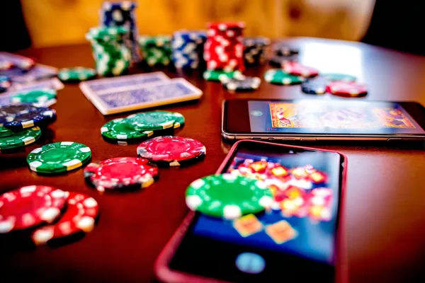 A glowing roulette wheel with cascading chips, symbolizing the engaging live and instant-win games available on JLWAFA.