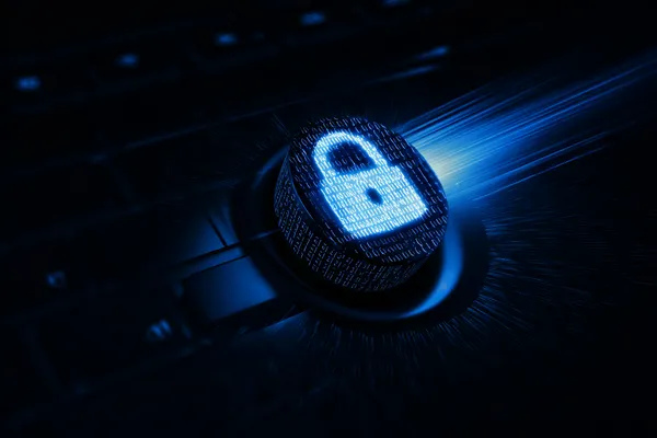 A laptop glowing with a bright login prompt in a minimalistic setup, symbolizing the protected access system at JLWAFA.